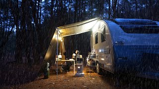 A cozy camping trailer in a quiet forest with no people even at -10 degrees Celsius.