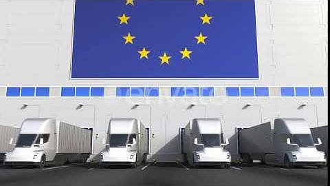 Electric Trucks at Warehouse Loading Dock with Flag of the EU | Motion Graphics - Envato elements