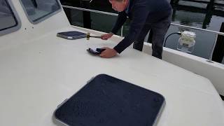 surveyor checking hull tapping