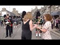 Massed Pipes & Drums parade stops to enjoy a wee dram before 177th Tomintoul Highland Games