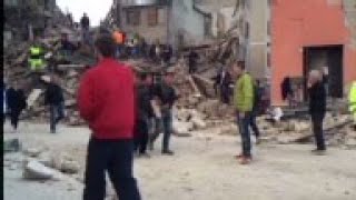 Italy - Person pulled from rubble in quake-hit Amatrice \/ Italian rescuer: 70 trapped under quake ru