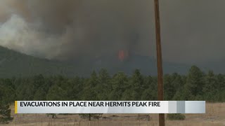 Hermits Peak continues to burn; forcing evacuations for some