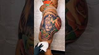 Leon tatuajes en los muslos para mujer