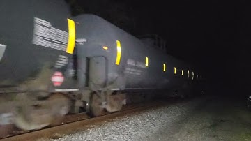 Q372 passes Doubs Road crossing on the old main with a dash 8 and rail train!