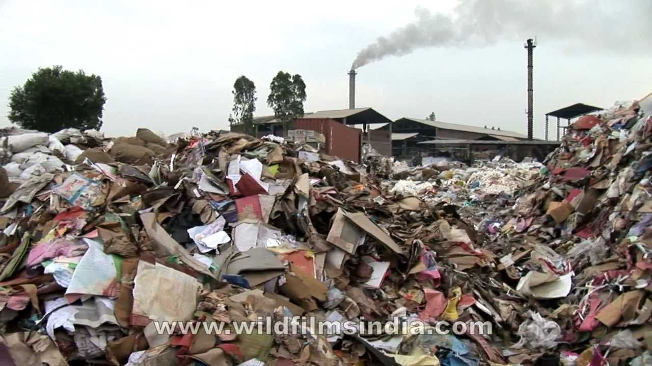 Imported household waste and scrap being recycled in India - YouTube