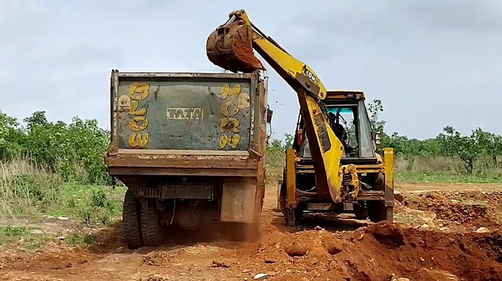 old JCB 3dx Backhoe Loading Mud in Tata 2518 Truck Dumper