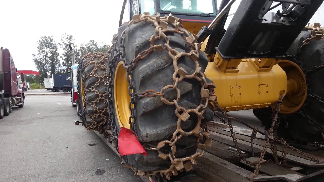 CAT 535B skidder with chains. YouTube