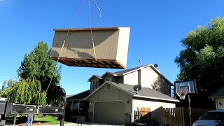 Moving a shed with a crane