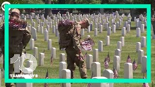 Soldiers place flags in Arlington Cemetery