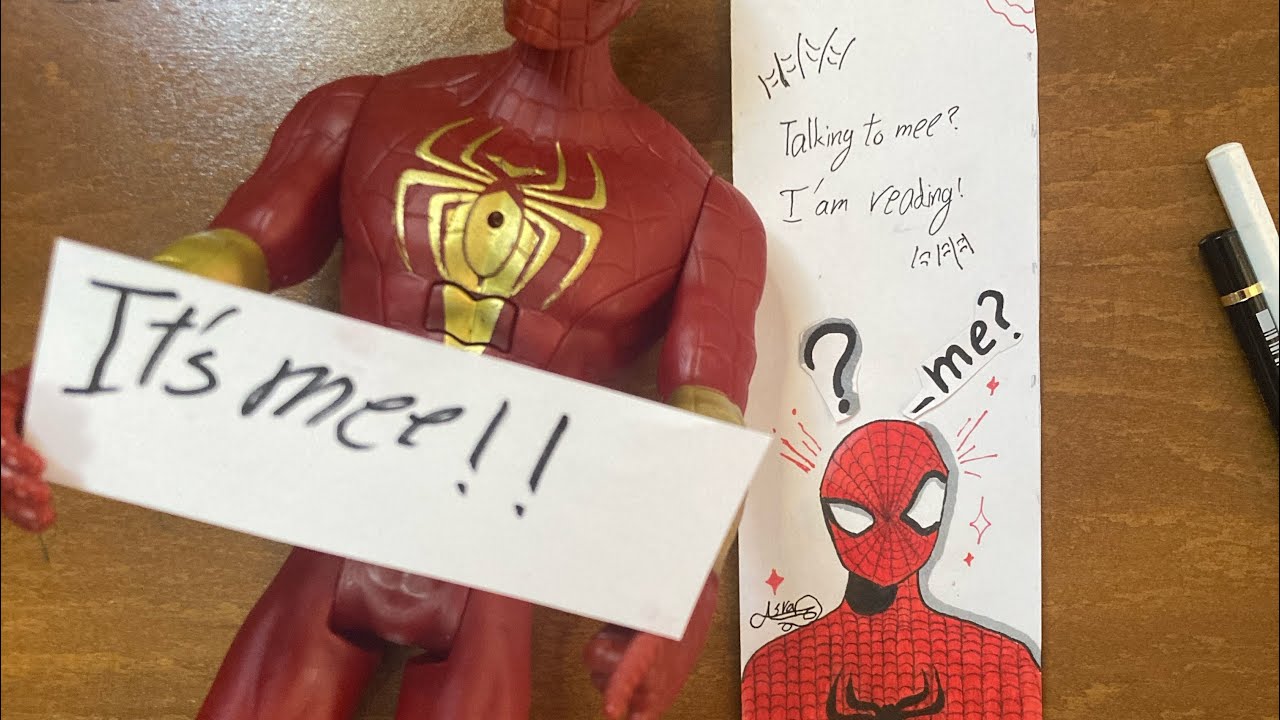 A Spider-Man bookmark climbing out of your book! 🕸️