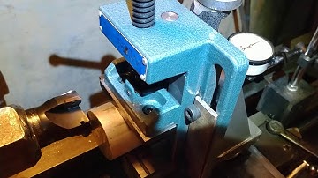 Atlas lathe milling with carbide inserted facemill.