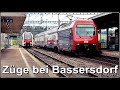 Personenzüge und ein SBB Postzug beim Bahnhof Bassersdorf