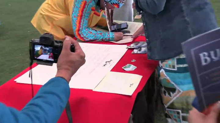 Chief Cody Thomas of Enoch Cree Nation signs the B...