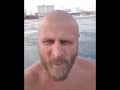 BALD man comes out of the water and eats ice