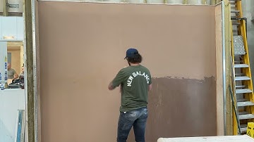 Plastering trainee showing off his NEW trowel skills.