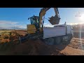 loading a excavator in to a topper