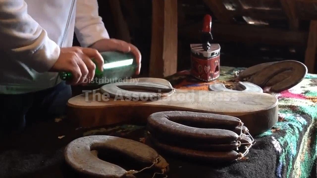 The rising fame of the flat sausage ironed with a glass bottle