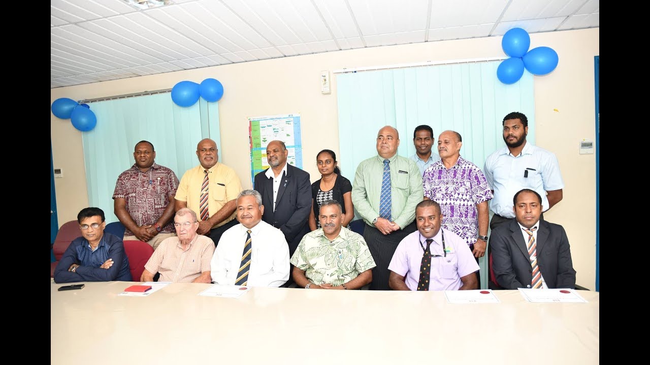 Fijian Minister Hon. Faiyaz Koya presents certificate to newly 3 registered surveyors.