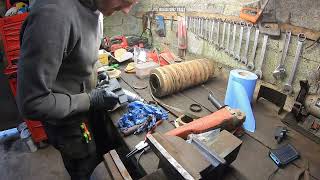 Track tensioner rebuild and excavator undercarriage fork re-adjustment