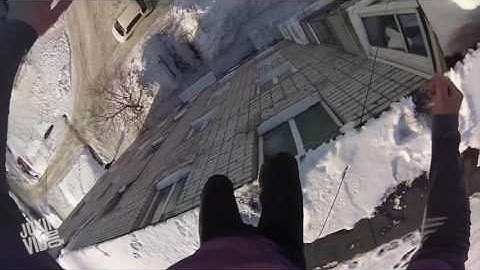Jumping Off a Ledge in Russia into Snow