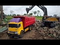 MOBIL TRUK CANTER MUATAN BATU - EXCAVATOR BEKO KERUK