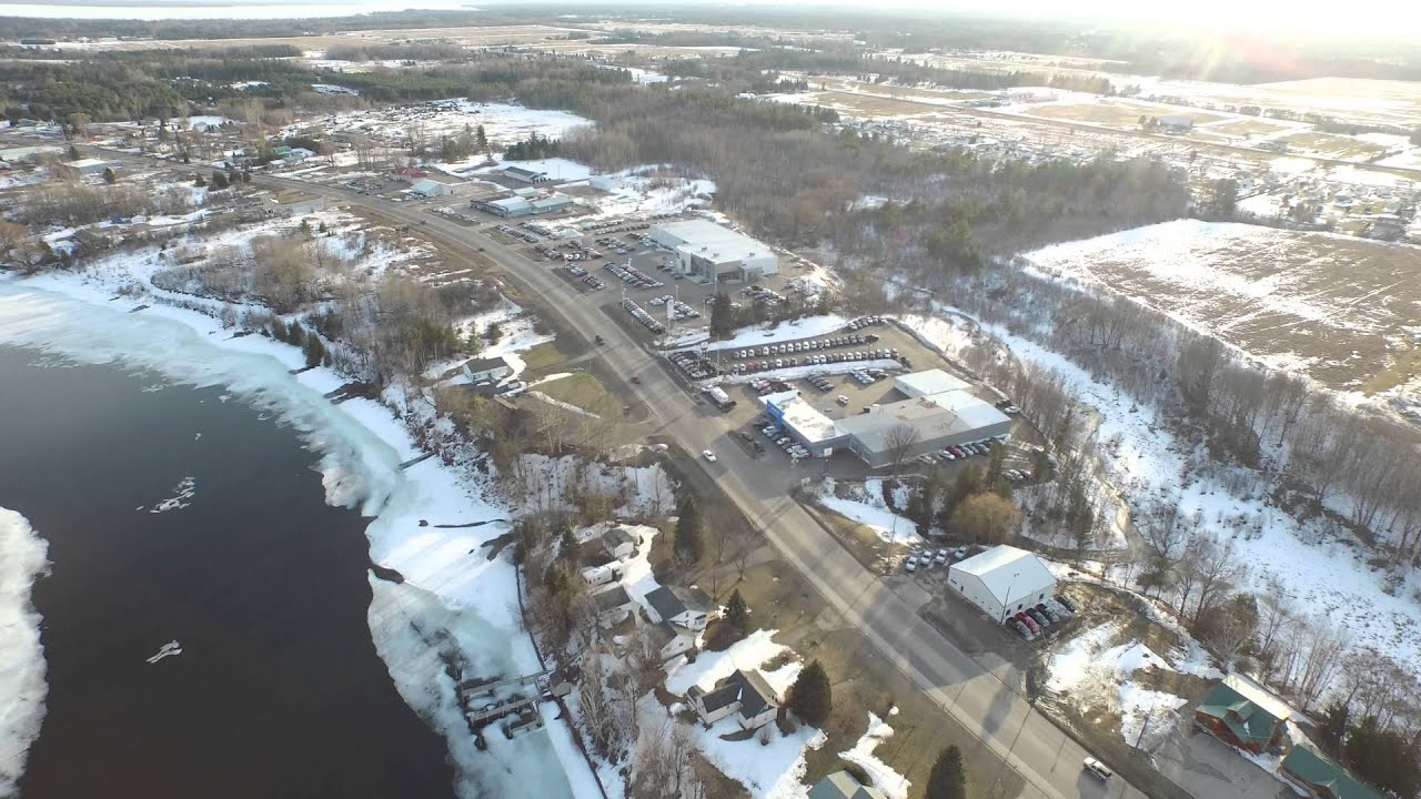 DJI Inspire 4K Drone Flyover Cheboygan River In Michigan In Front Of