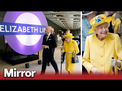 Queen beams in sunshine yellow for surprise visit to see Elizabeth line