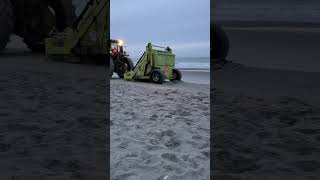 Beach clean-up before sunrise #cleanbeach #tractor #oceanwaves #coastalescape #earlymorning