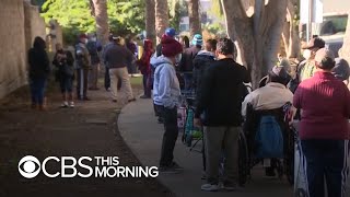 With food insecurity on the rise nationwide, food banks see massive Thanksgiving lines
