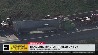Tractor-trailer dangles from overpass in Washington County