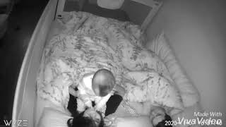 Baby Monitor Captures Infant Refusing To Sleep And Climbing Over His Mother