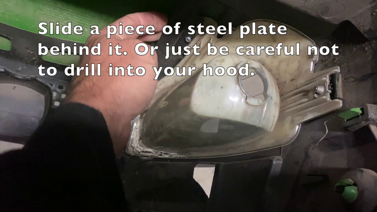 How to repair or fix a loose headlight on a John Deere Lawn Tractor D