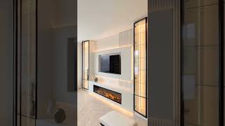 Media wall in white matt and black frame Glass doors. Electric fire and led lights #mediawall