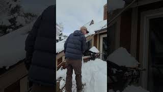 Avalanche rake clearing solar panels 22' of snow