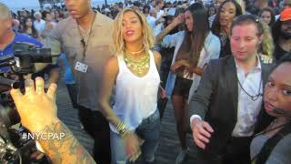 Beyoncé surrounded by fans as she tries to films her XO video in coney island Brooklyn