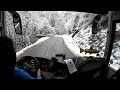 Early bus drive to snowy mountain in the Alps