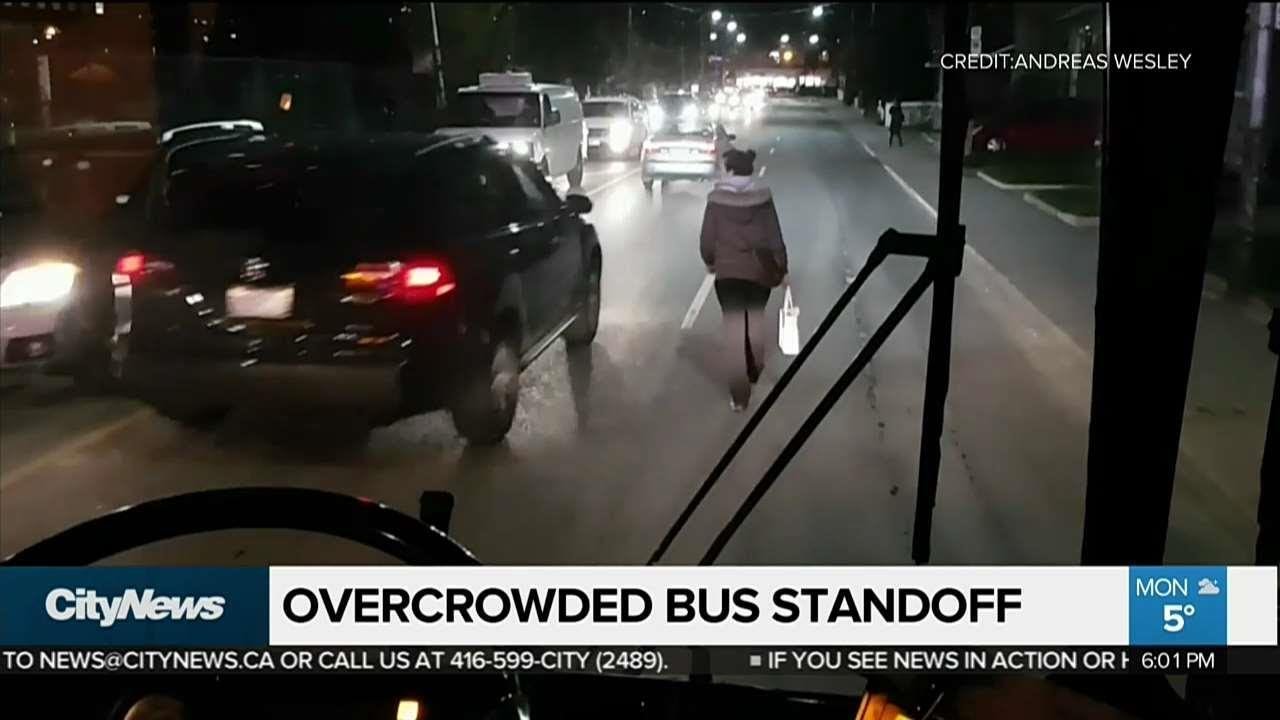 Overcrowded bus leads to street stand off - YouTube