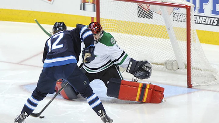 Olli Jokinen fakes out Tim Thomas to score