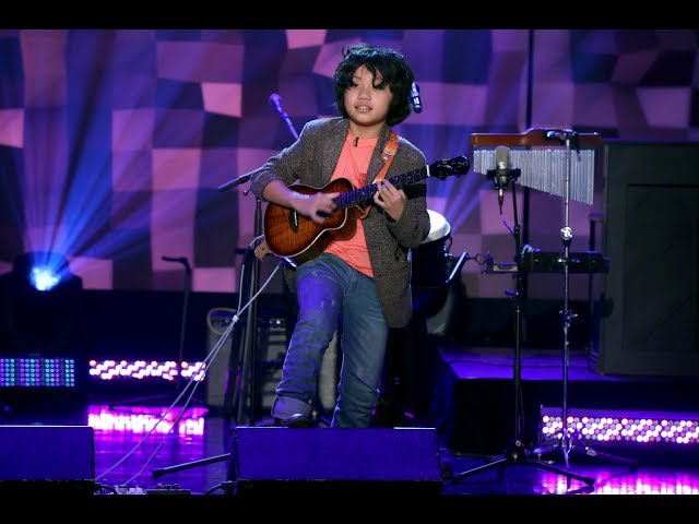 Talented Kid Ukulele Prodigy Feng E Takes the Stage class=