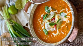 Red lentil curry soup with spinach and coconut milk - healthy soup full of fibre and protein