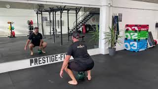 Kettlebell Single Arm Power Squat demonstration