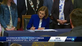 Kim Reynolds signs bill protecting land from foreign ownership