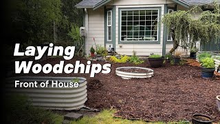 Laying woodchips in front of house