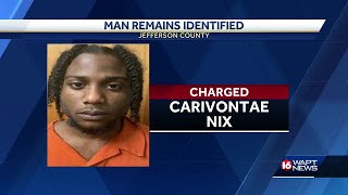 Man arrested after human remains found