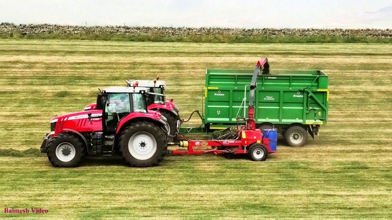 Silaging with Trailed Forager.  Loads of Masseys.