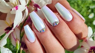 Watch me doing my nails in white with chrome and Swarovski crystals.