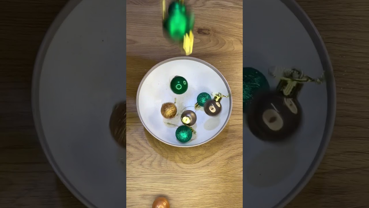 Dropping Christmas Baubles Into The Bowl 