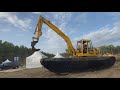 Komatsu pc110 big float comes out of the water