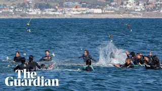 Surfers honoured in paddleout as families confirm identity of bodies in Mexico