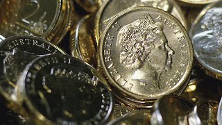 Australian dollar drops to five-year low, dips below 60 US cents